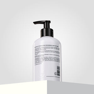 Keratin smooth daily shampoo, designed specifically for Indian hair texture, stands against a gray background.