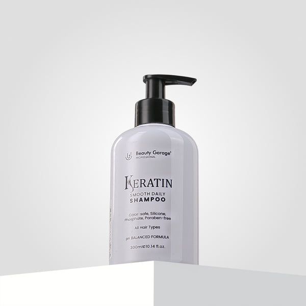 A bottle of Basic Keratin Smooth Daily Shampoo with a pump dispenser, perfectly labeled for all hair types.