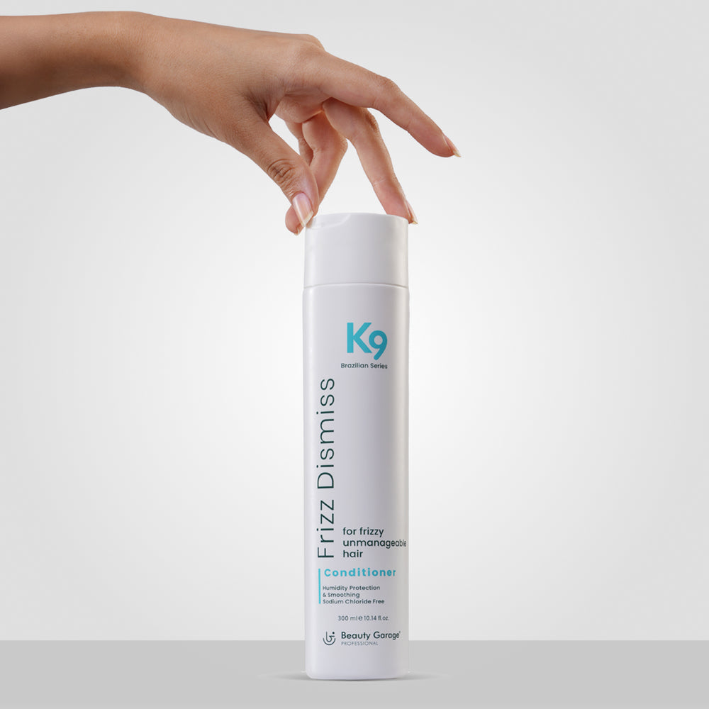 K9 Frizz Dismiss Conditioner with Botoplexx technology for frizzy, unmanageable hair, 200 ml, on a light gray background.