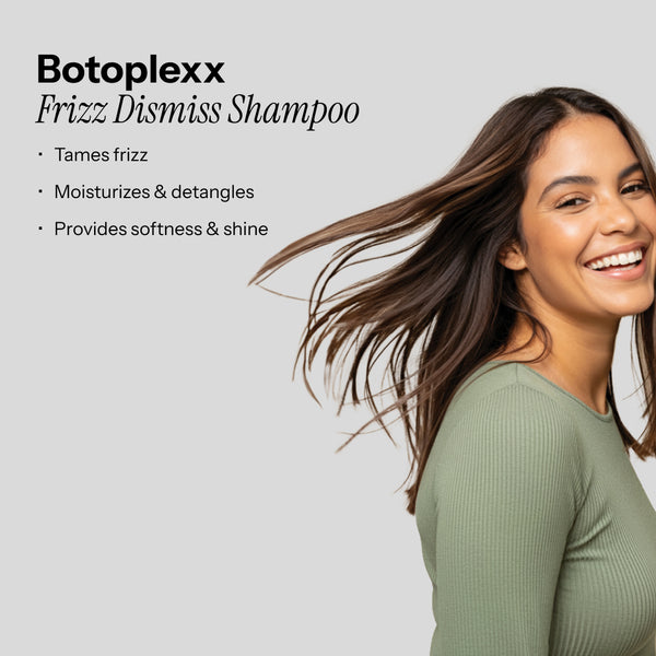 A model with long, smooth hair smiles, embodying the effects of Botoplexx K9 Frizz Dismiss Shampoo.