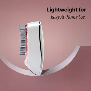 Electric handheld grooming device with comb-like attachments and glowing red lights, ideal for a hair growth lifestyle.