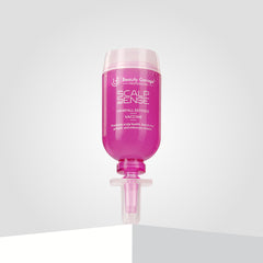 A pink bottle of ScalpSense Hairfall Defense Vaccine by Beauty Garage.