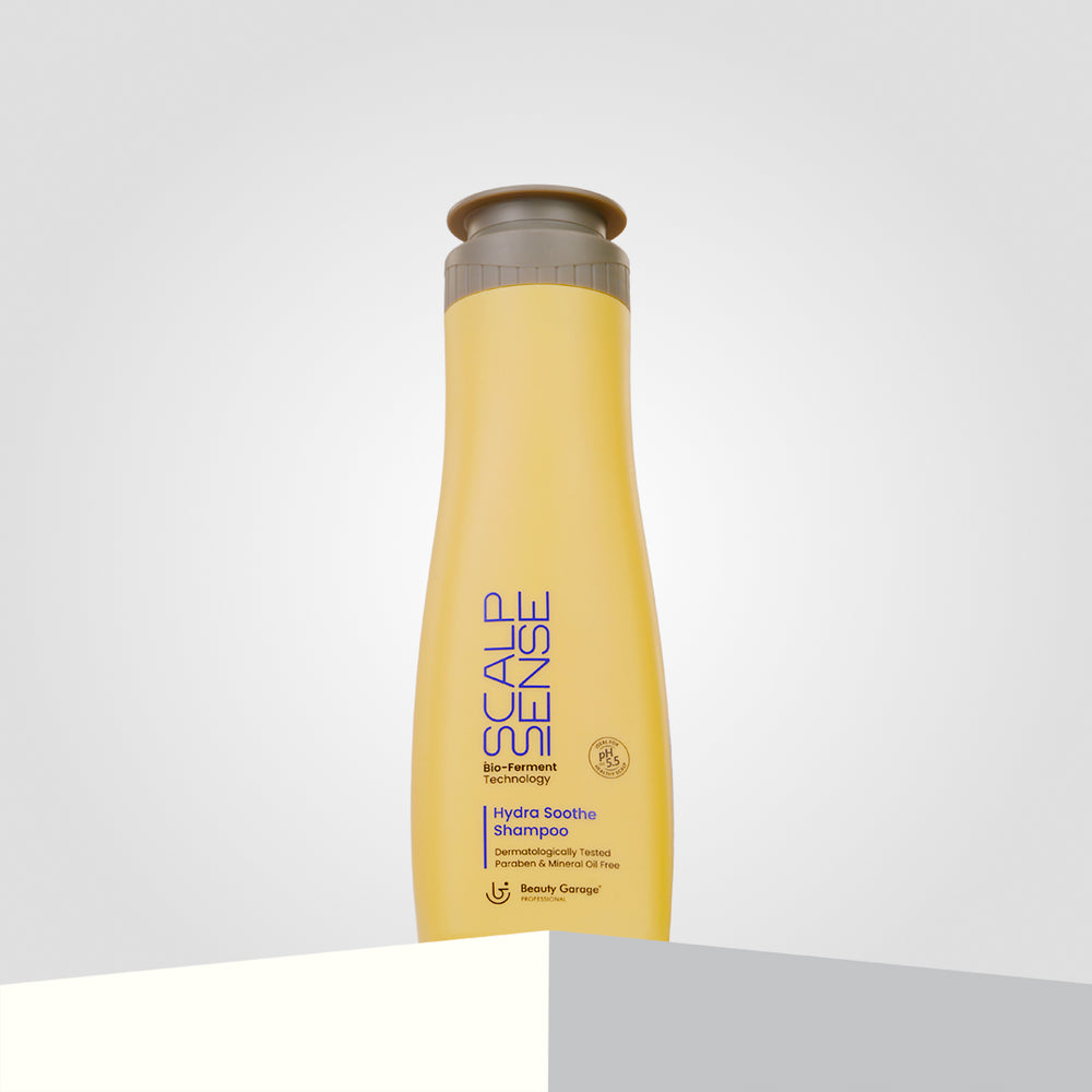 A vibrant yellow bottle of ScalpSense Bio-Remedy Hydra Soothe Shampoo.