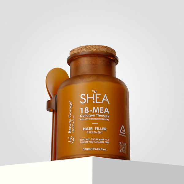 A bottle of Shea 18-Mea Collagen Hair Filler Treatment stands against a gray background