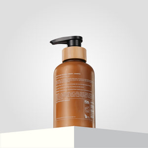 A backshot of the Shea-18 Mea Collagen Therapy Shampoo bottle.