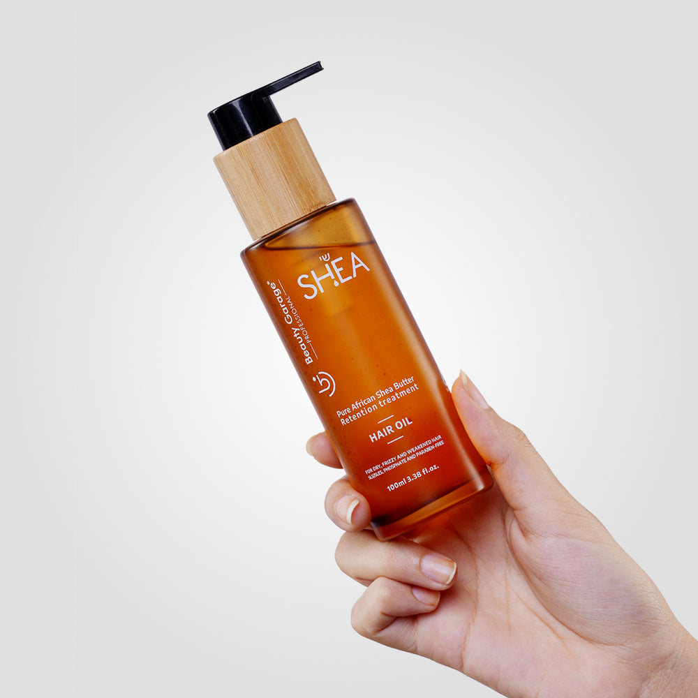 A brown bottle of Shea Retention hair oil for your hair care routine.