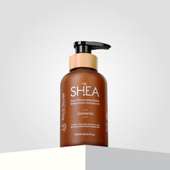 A brown bottle of Shea Retention Shampoo with a pump dispenser, labeled "Pure Shea Butter Retention Treatment".