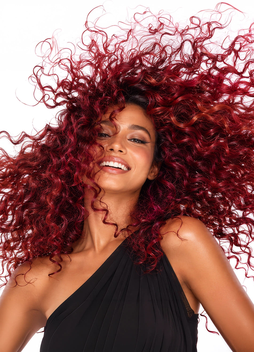Woman with voluminous red curls in motion