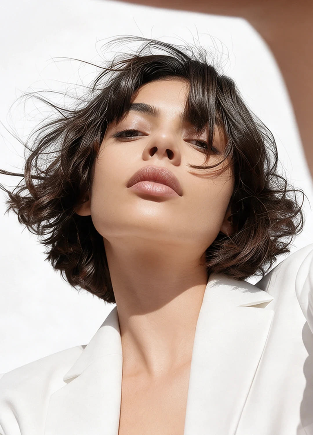 Woman with short dark wavy hair