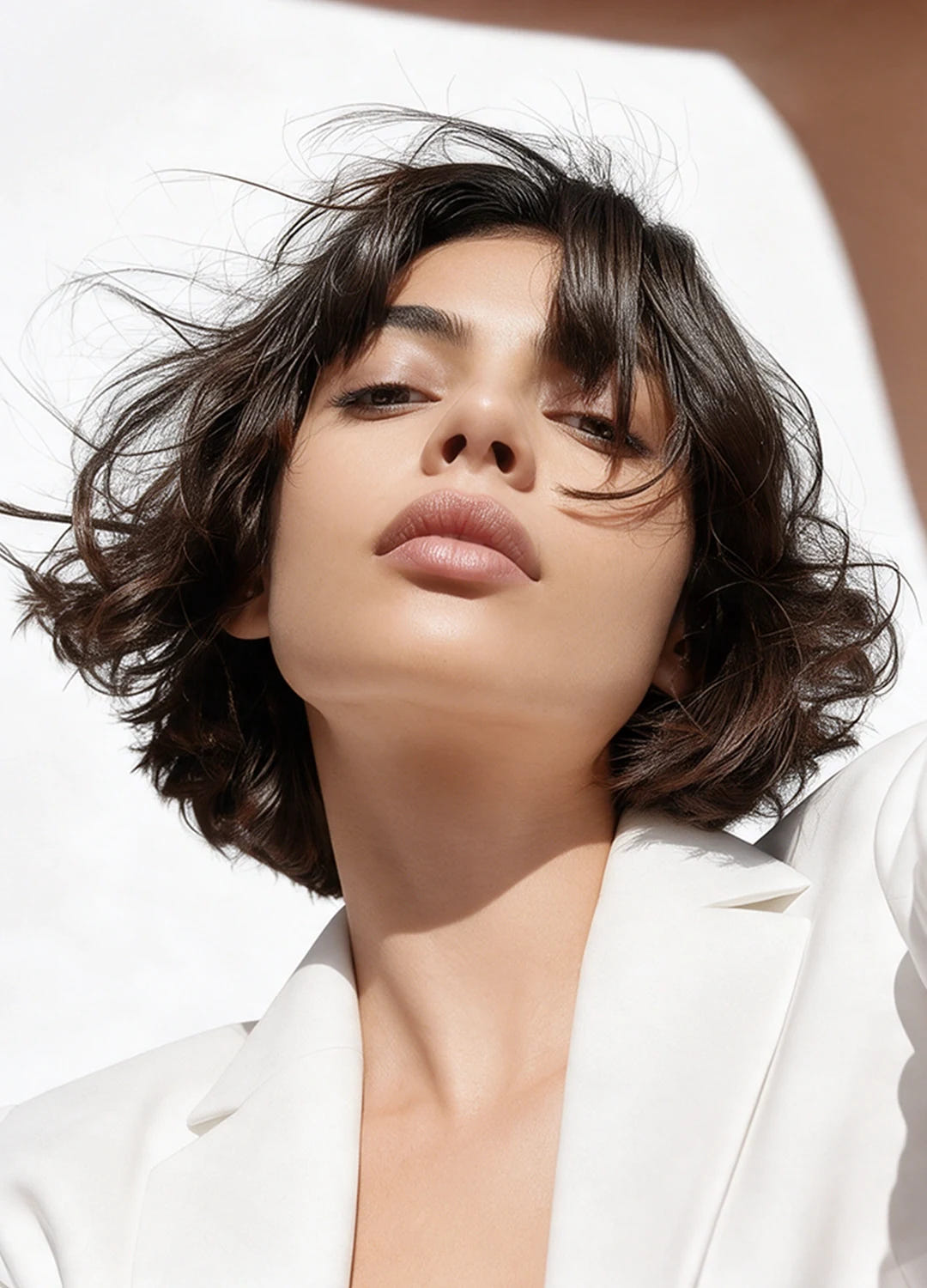 Woman with short dark wavy hair