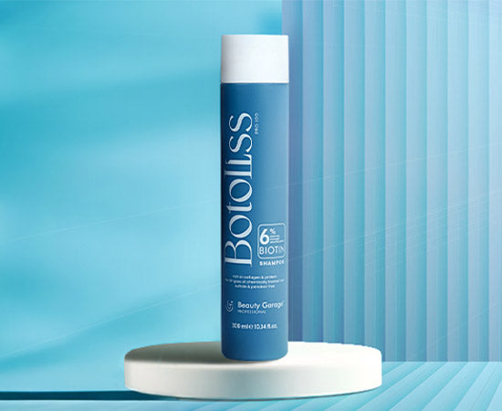 Blue Botoliss Shampoo bottle with blue striped background, reflecting Beauty Garage's premium collection essence.